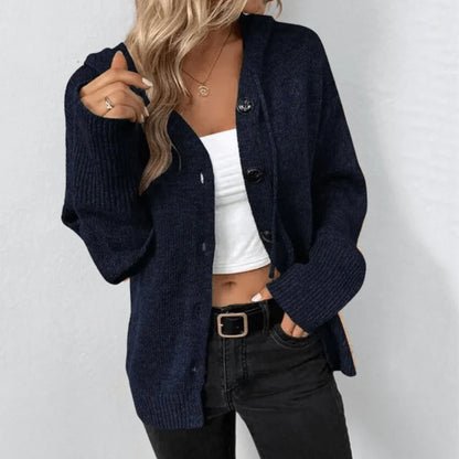Warm women's knitted cardigan with buttons