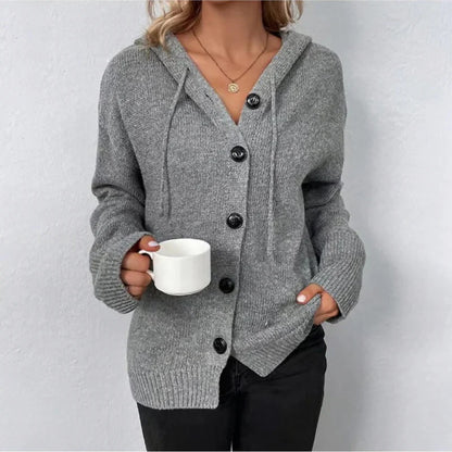 Warm women's knitted cardigan with buttons