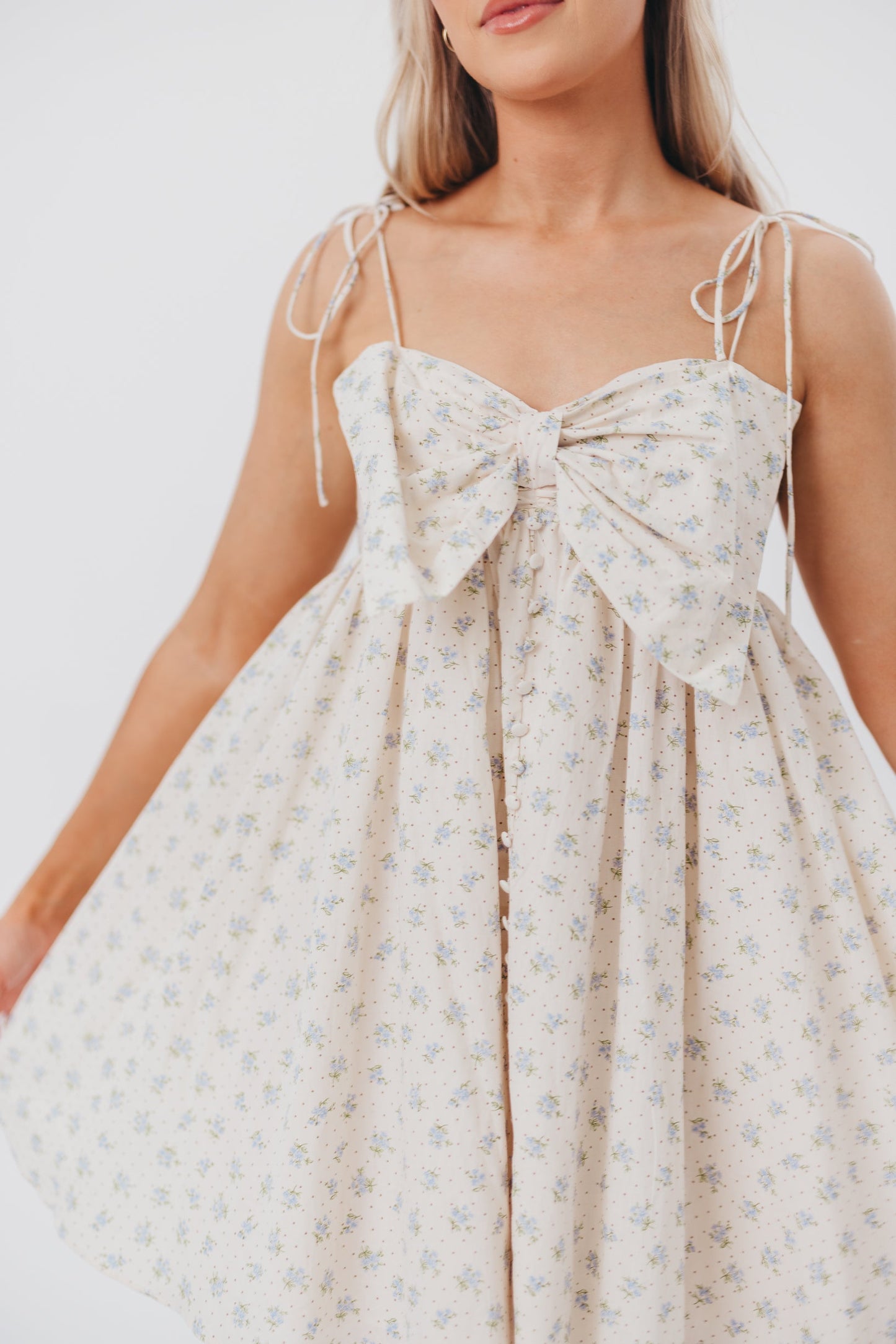 Irelyn Babydoll Mini Dress with Bow Accent in Cream/Blue Floral & Polka Dot