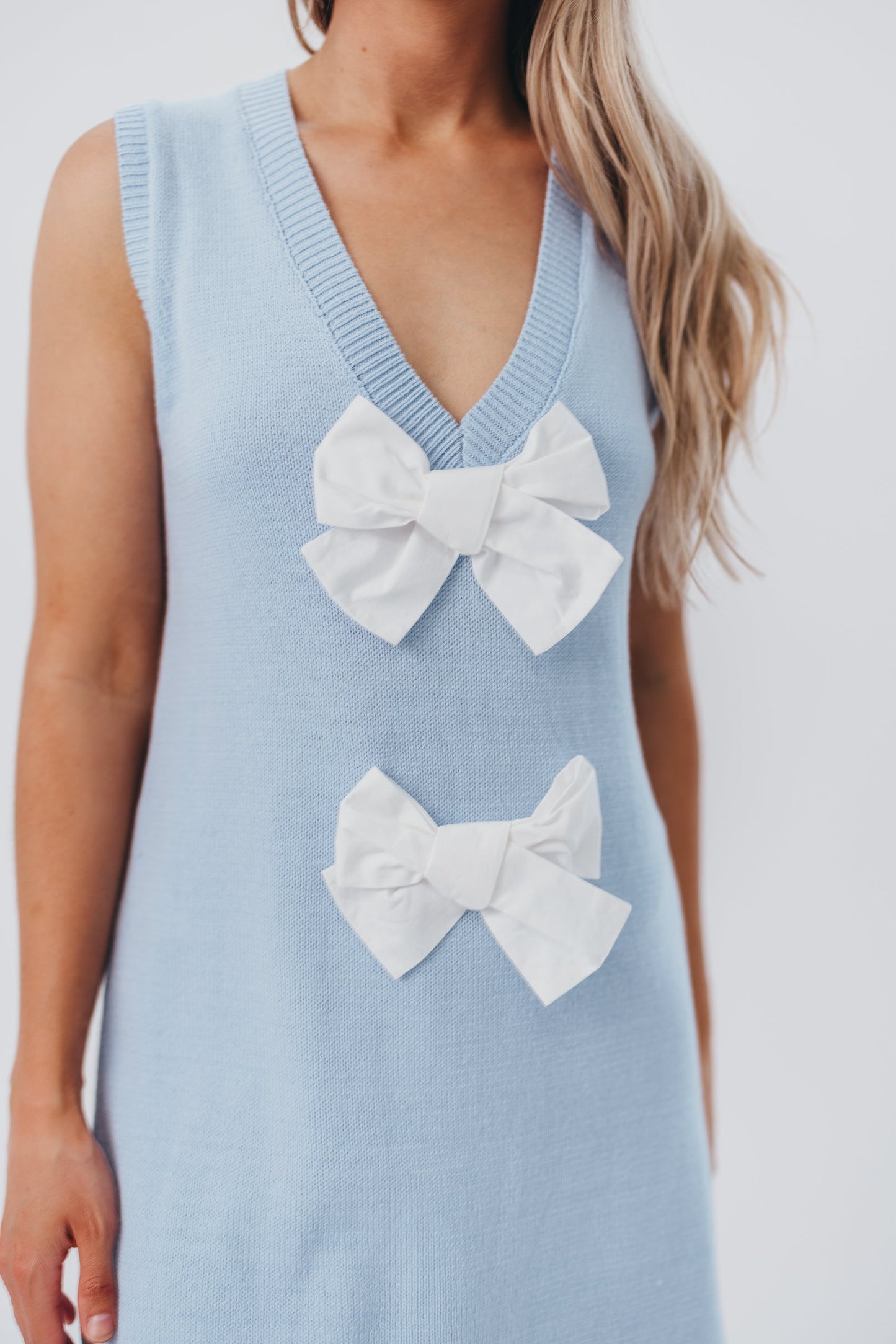 Wendy Sleeveless Sweater Mini Dress with Front Bow Detail in Sky/White