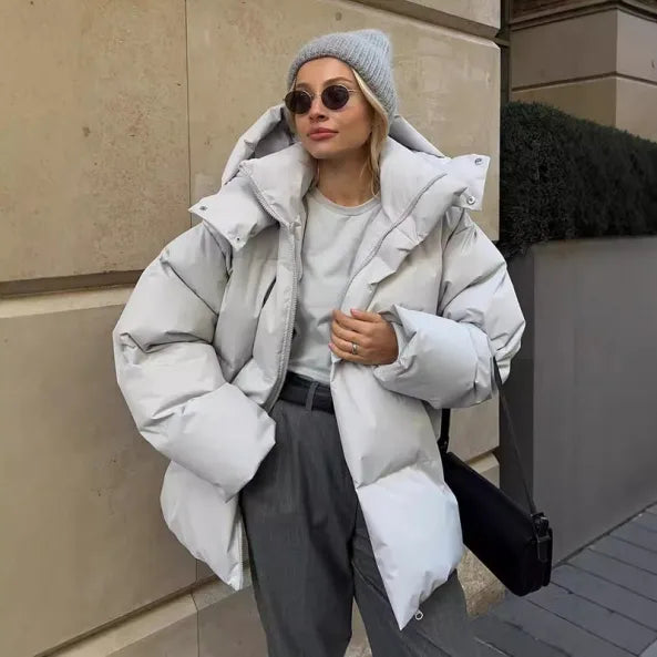 Warm women's winter jacket with hood
