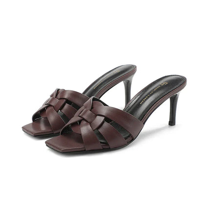 Women's leather mules with heel and bow accent