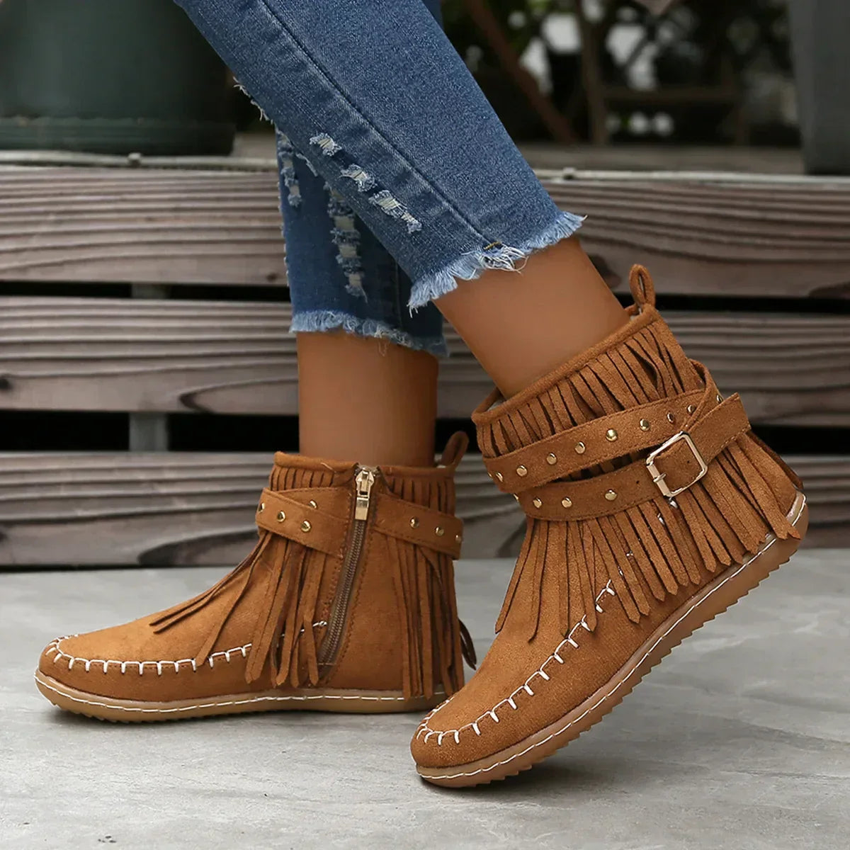 Suede ankle boots with fringe and studs