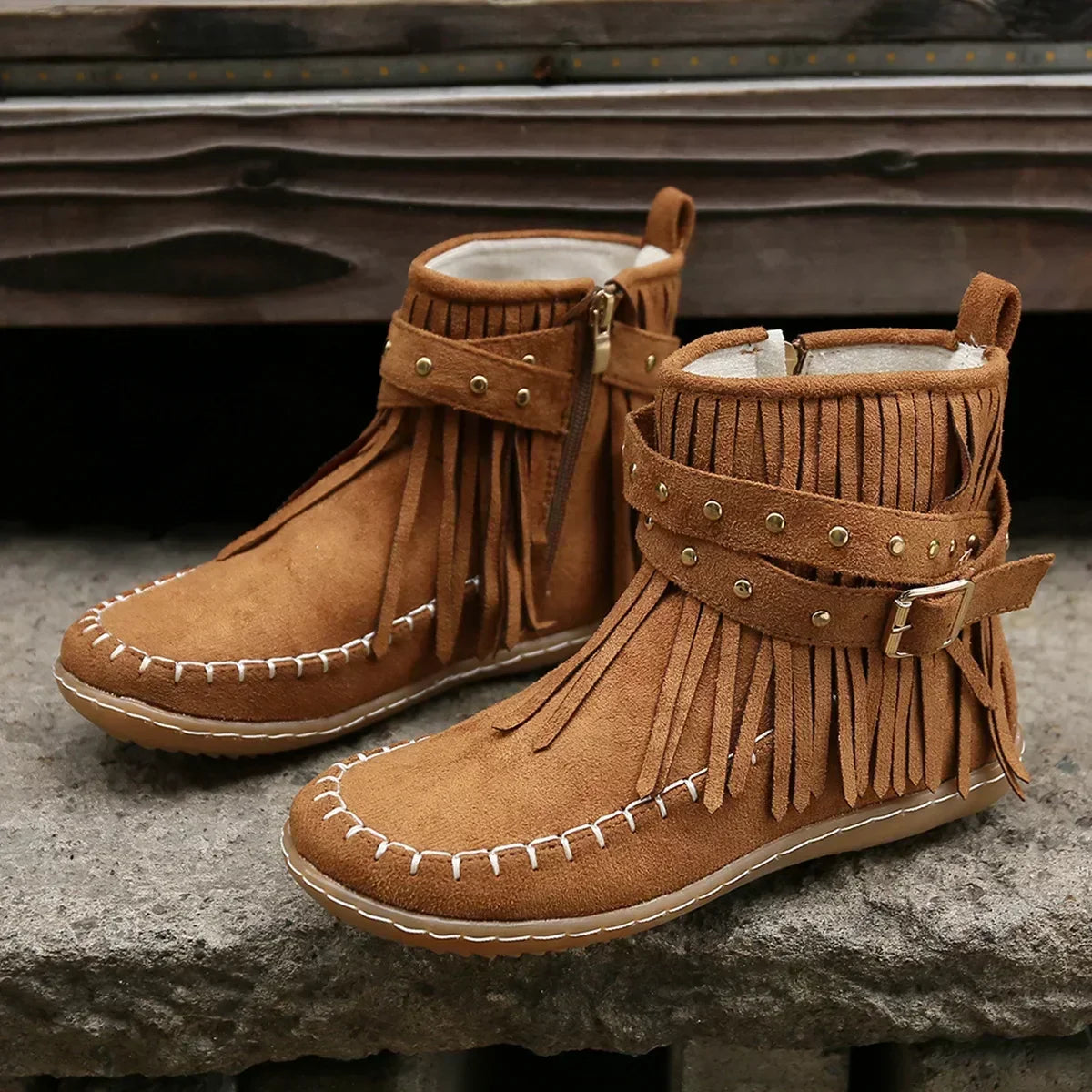 Suede ankle boots with fringe and studs