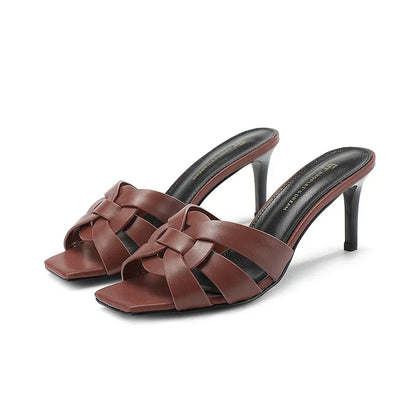 Women's leather mules with heel and bow accent